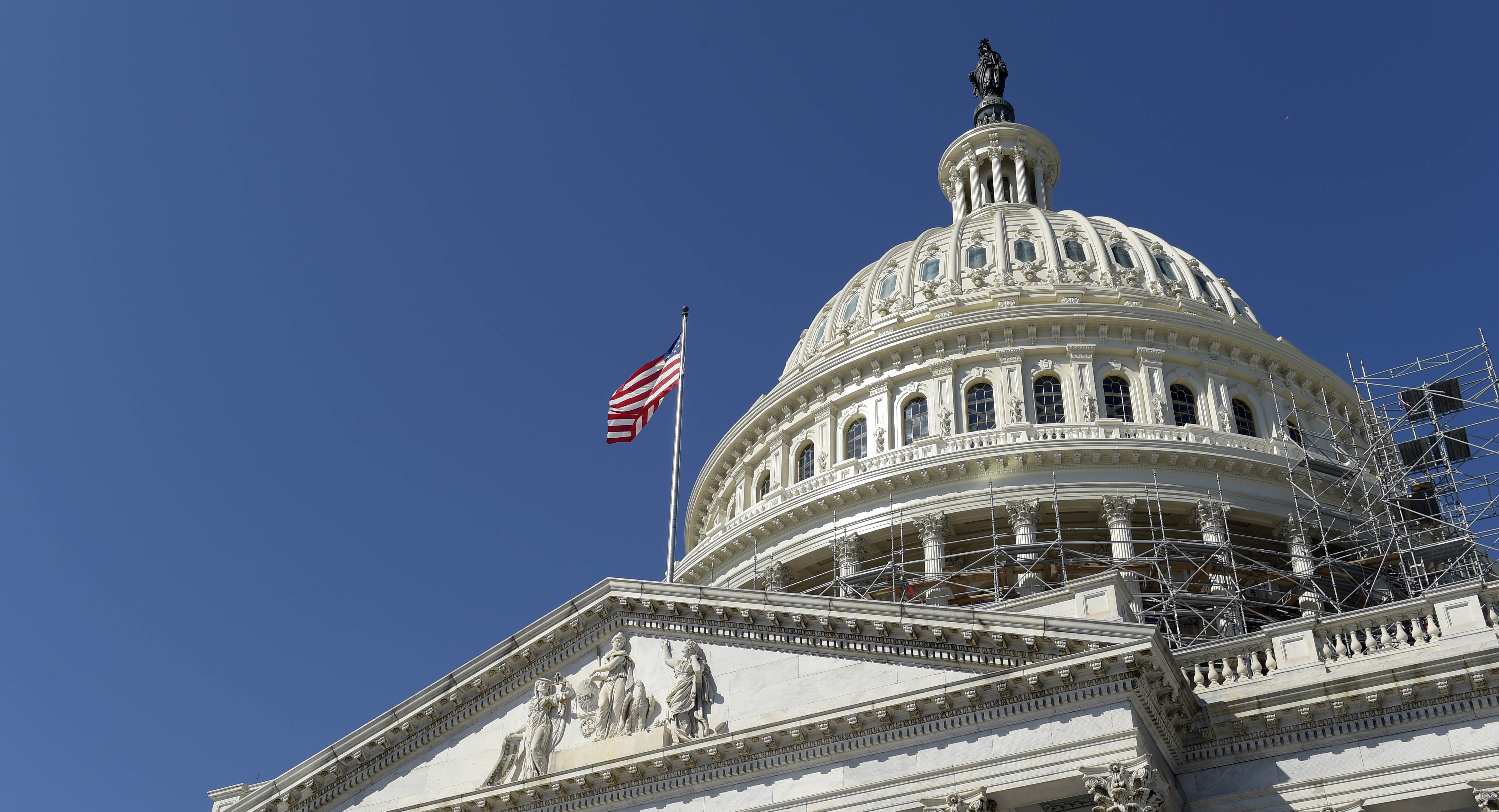 Photograph of the United States Capitol building from below.
