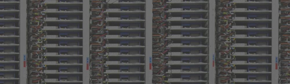 Textual photograph of a data center with rack-mounted server.