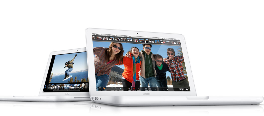 Image of two 2009 unibody MacBooks running iLife applications.